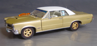 Click image to see more information about our 1965 Hurst Edition GTO with White Vinyl Top!